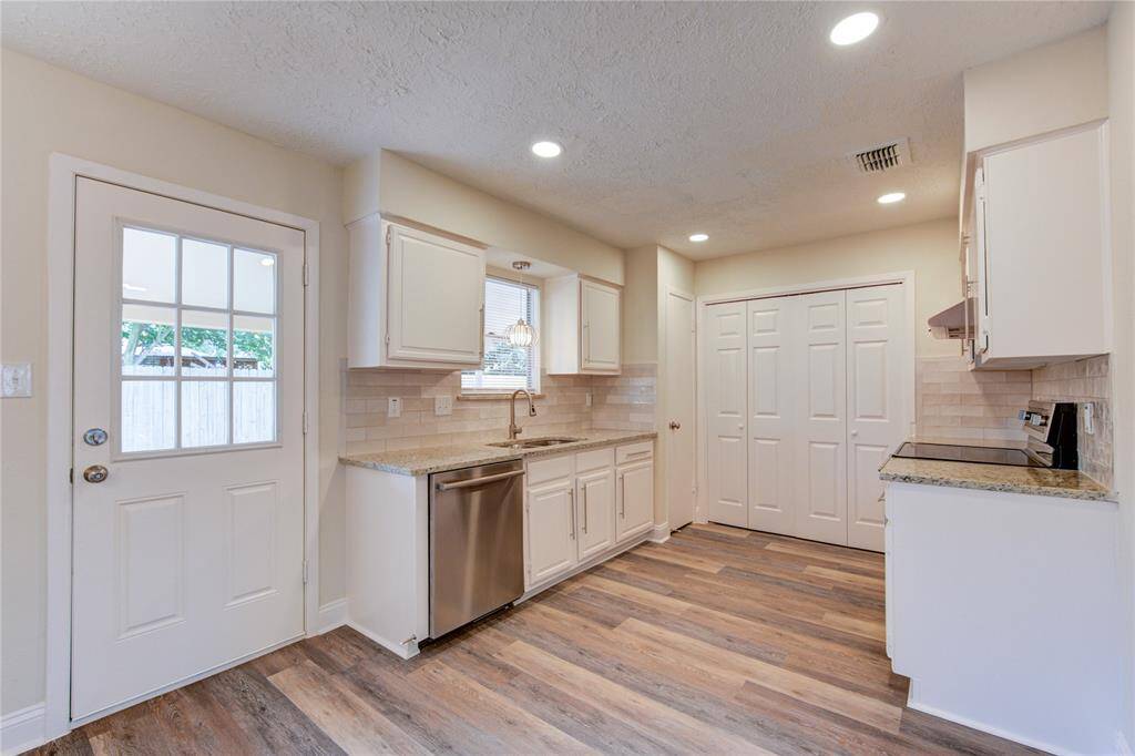Kitchen ahs been updated with new granite counters and new backsplash, new undermount sink and faucet, new recessed LED lighting, and stainless steel appliance!
