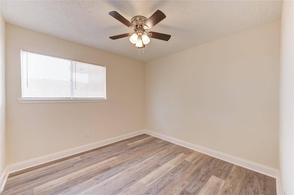 Bedroom 2.  All bedrooms have blinds and ceiling fans!