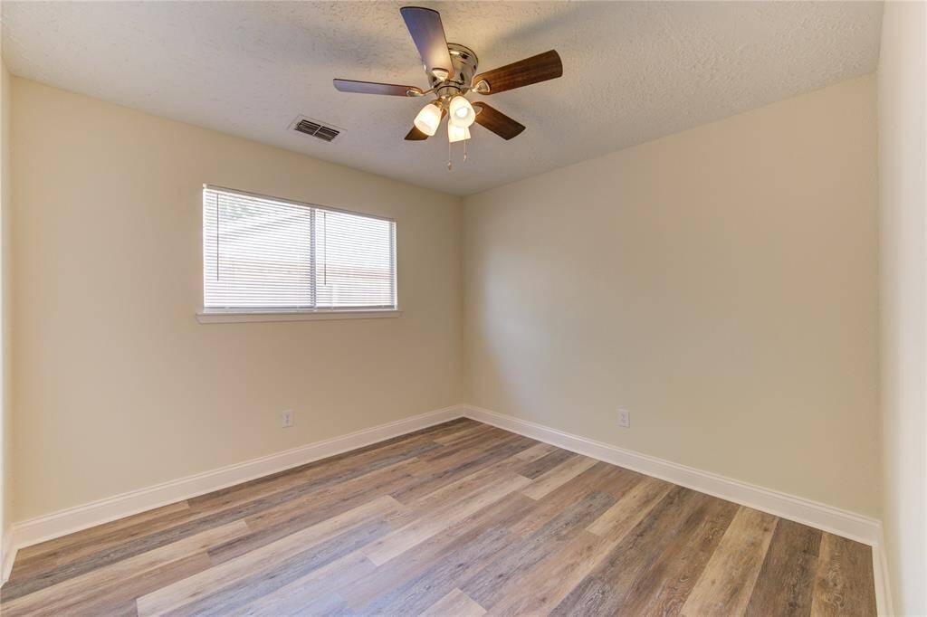 Bedroom 3.  All bedrooms have blinds and ceiling fans!