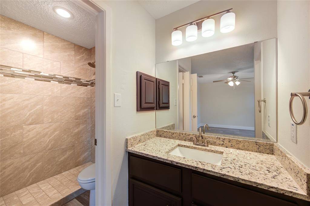 The primary bath has new granite and undermount sink, new faucet, new mirror, new light fixture and hardware.  The primary also has a brand new tiled shower with new faucet/valve.