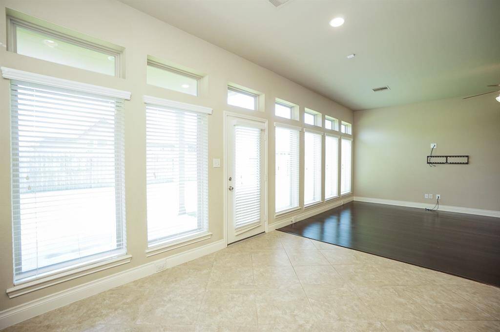Here, again, we see the beauty and versatility of an open floor plan, which seamlessly blends dining/living areas.