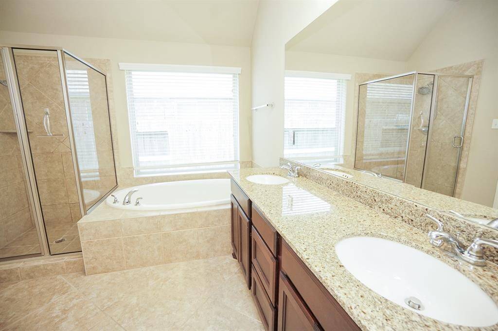 We're beginning to see sophisticated, linear appointments in primary baths; to ease comfort and convenience. Simplicity welcomes easy elegance in this bath, with dual sinks, set in luscious granite counters.