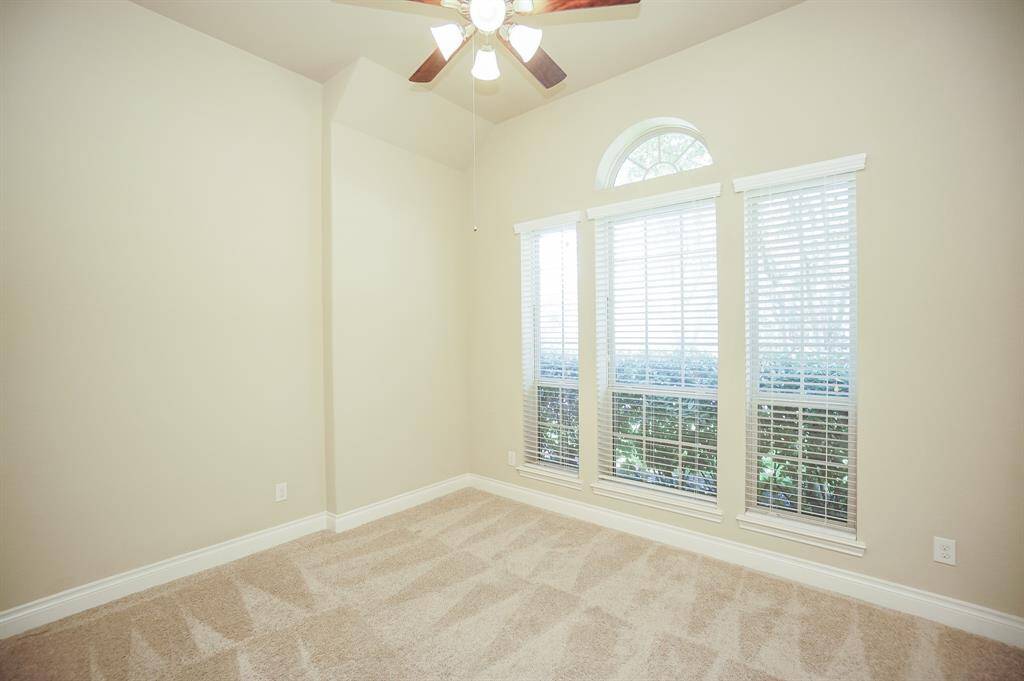 Triple arched windows bring sheer natural light.