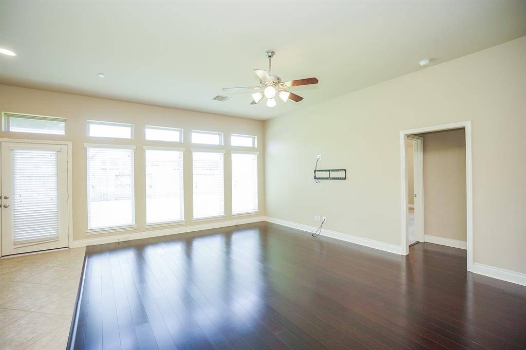 This expansive area is your huge, window-lined living area.