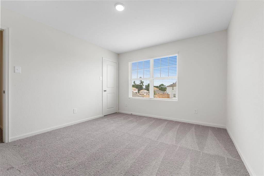 Two additional upstairs bedrooms with ample closet space and easy access to a well-appointed full bathroom.