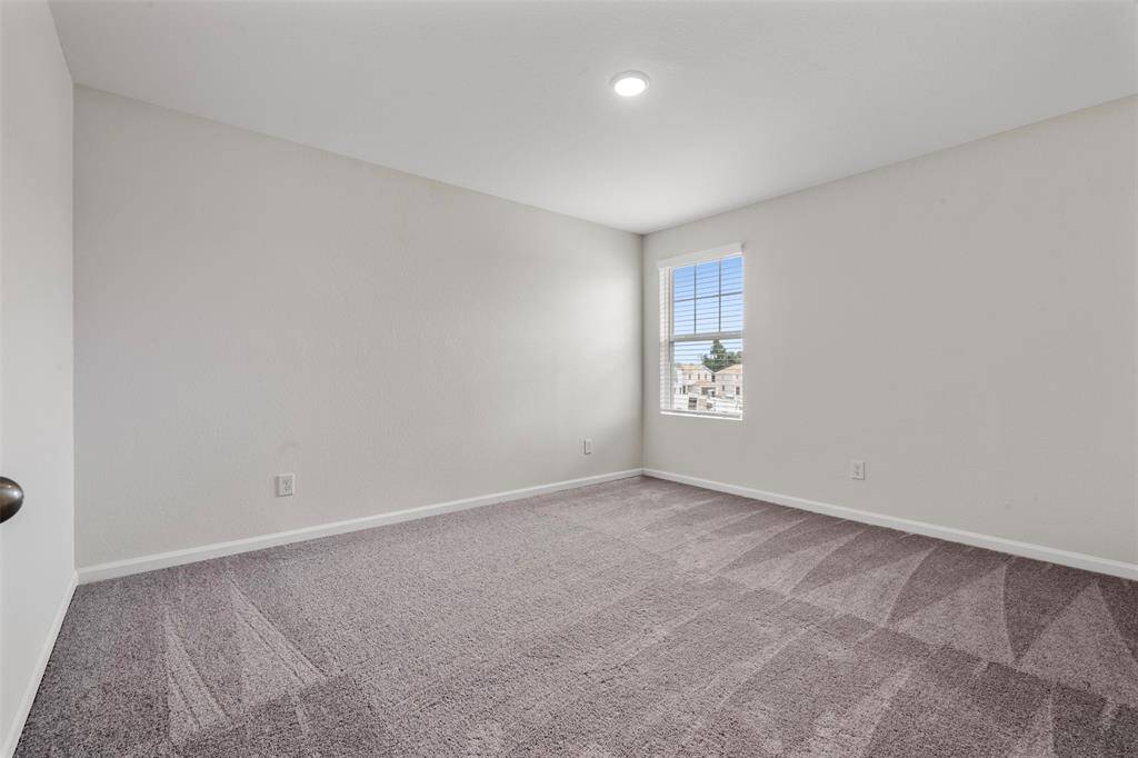 Two additional upstairs bedrooms with ample closet space and easy access to a well-appointed full bathroom.