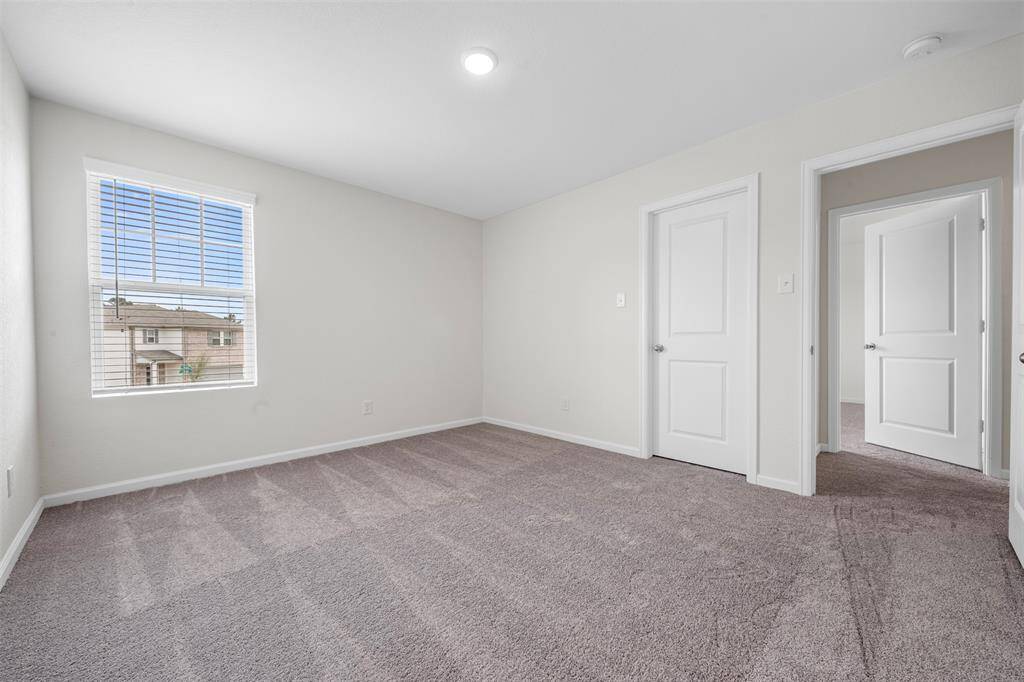 Two additional upstairs bedrooms with ample closet space and easy access to a well-appointed full bathroom.
