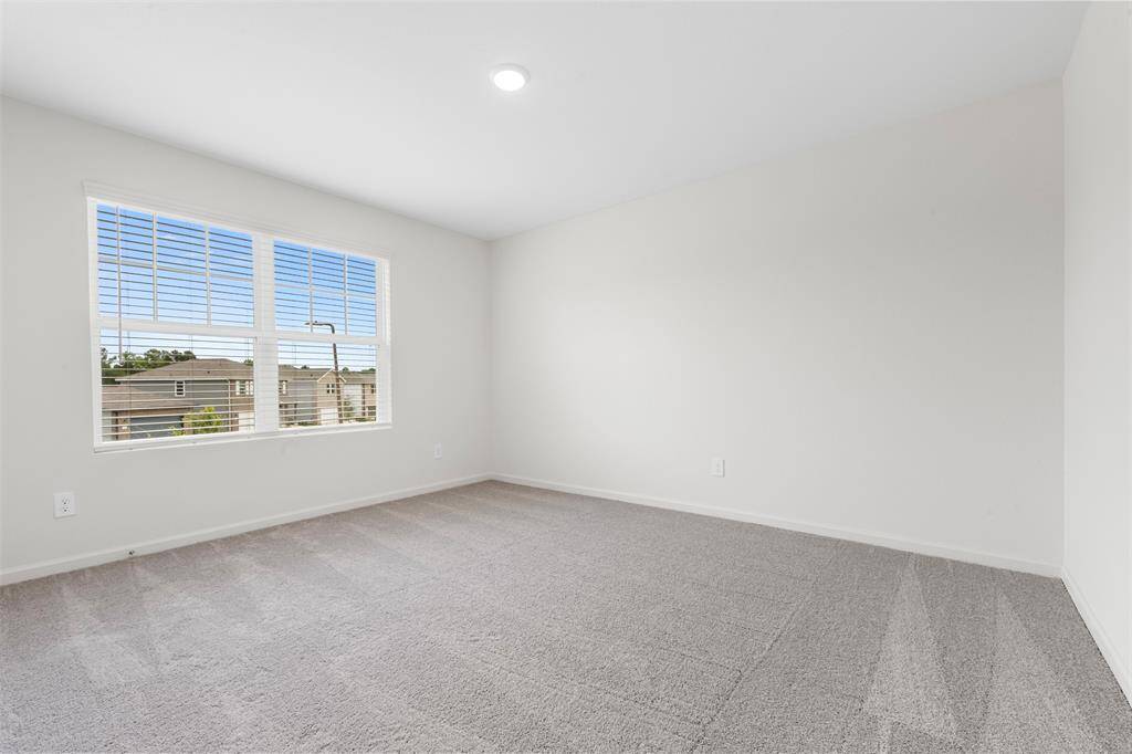 Two additional upstairs bedrooms with ample closet space and easy access to a well-appointed full bathroom.