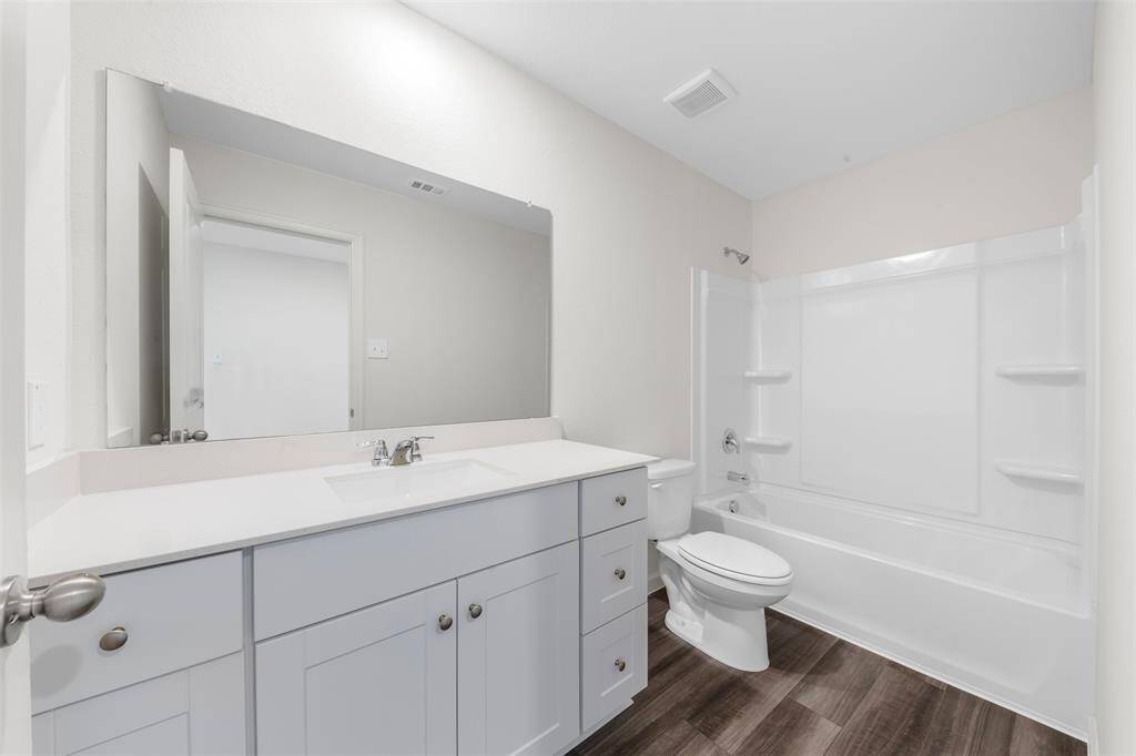 A large upstairs game room providing versatile space for a play area, media room, or home office.