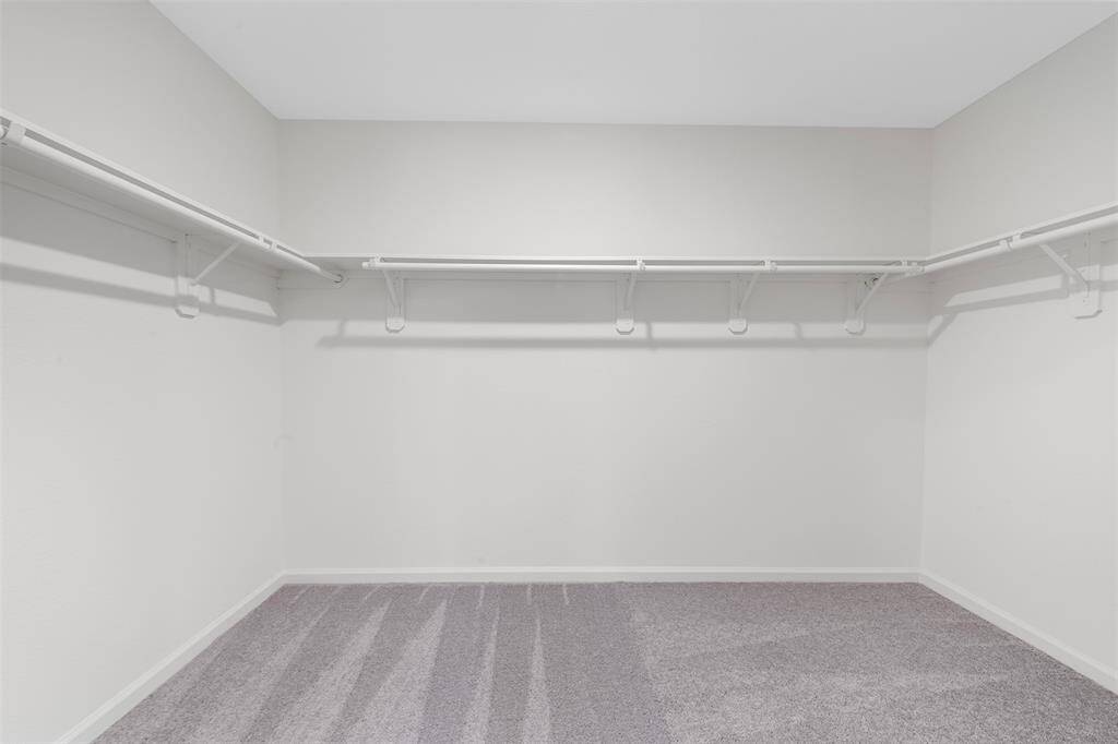 A large upstairs game room providing versatile space for a play area, media room, or home office.