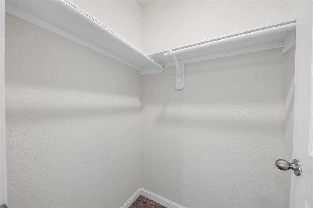 A large upstairs game room providing versatile space for a play area, media room, or home office.
