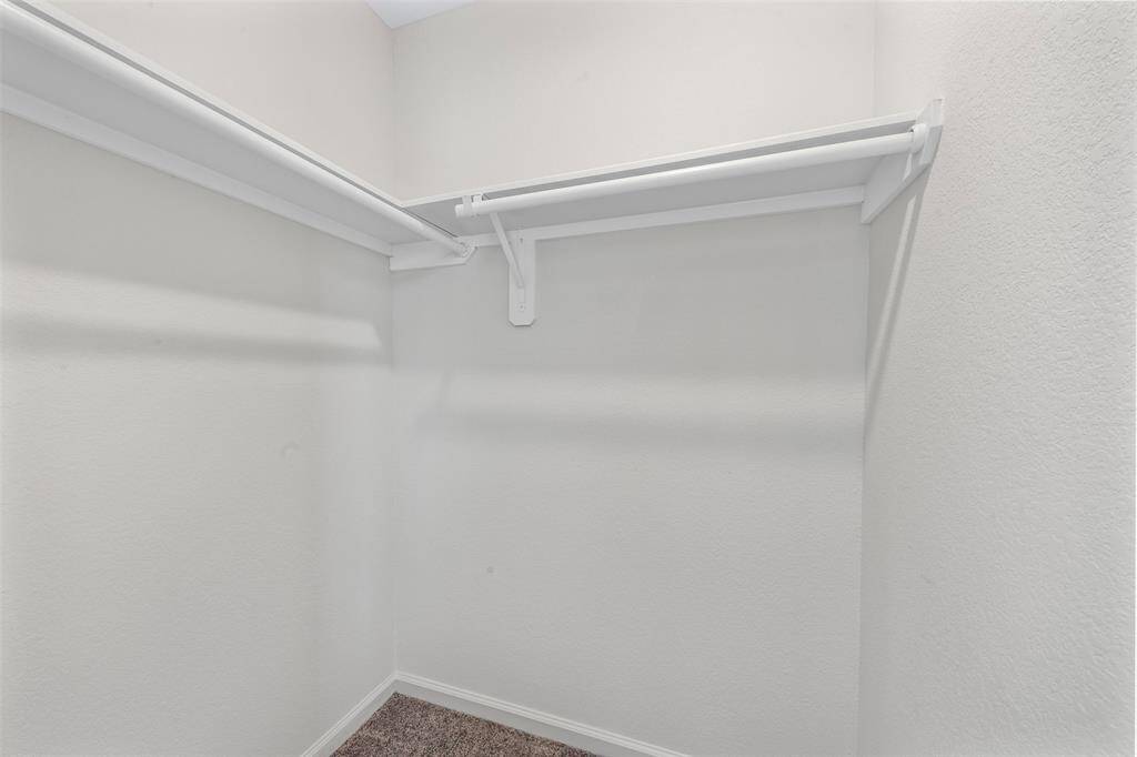 A large upstairs game room providing versatile space for a play area, media room, or home office.