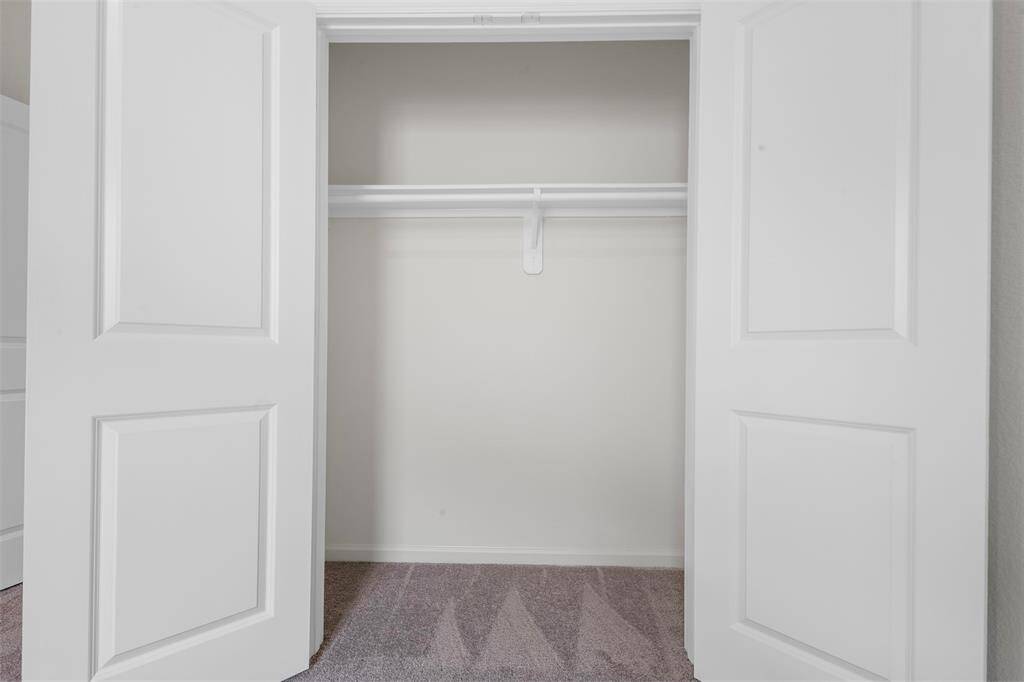 A large upstairs game room providing versatile space for a play area, media room, or home office.