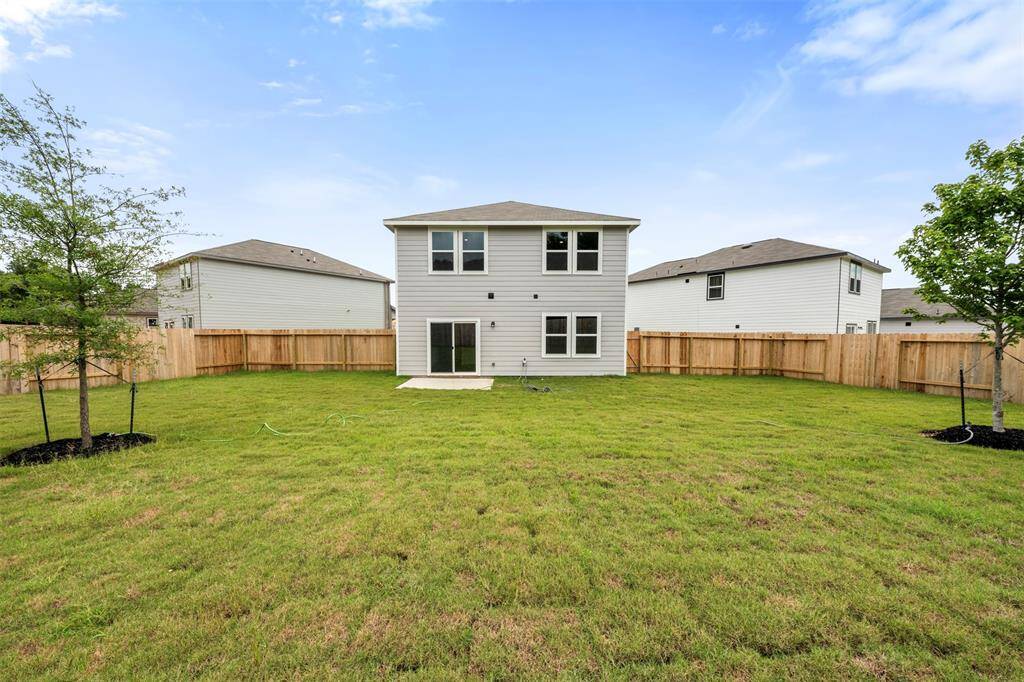 A private backyard space, ready for personal landscaping touches, perfect for outdoor activities and relaxation.