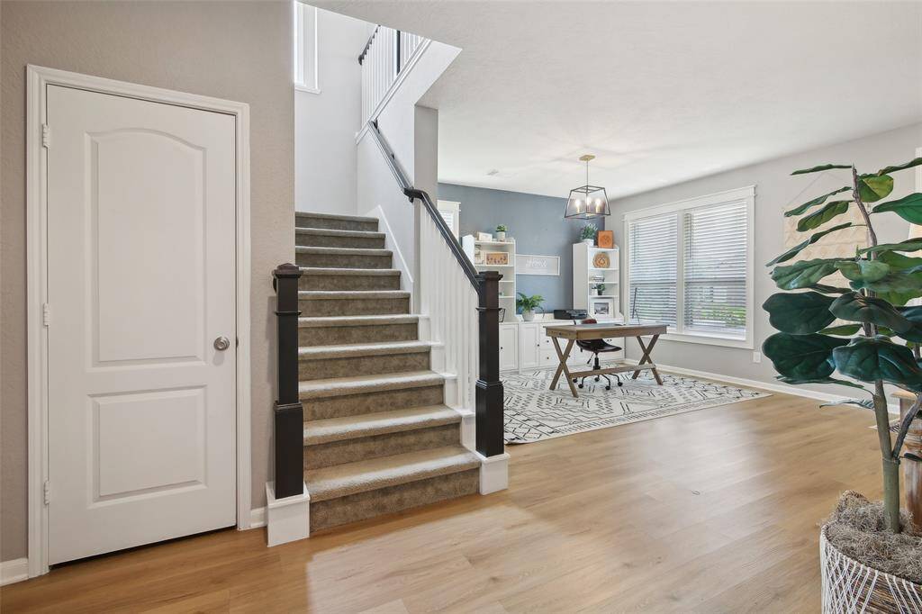 A large, deep storage closet is located under the stairs.