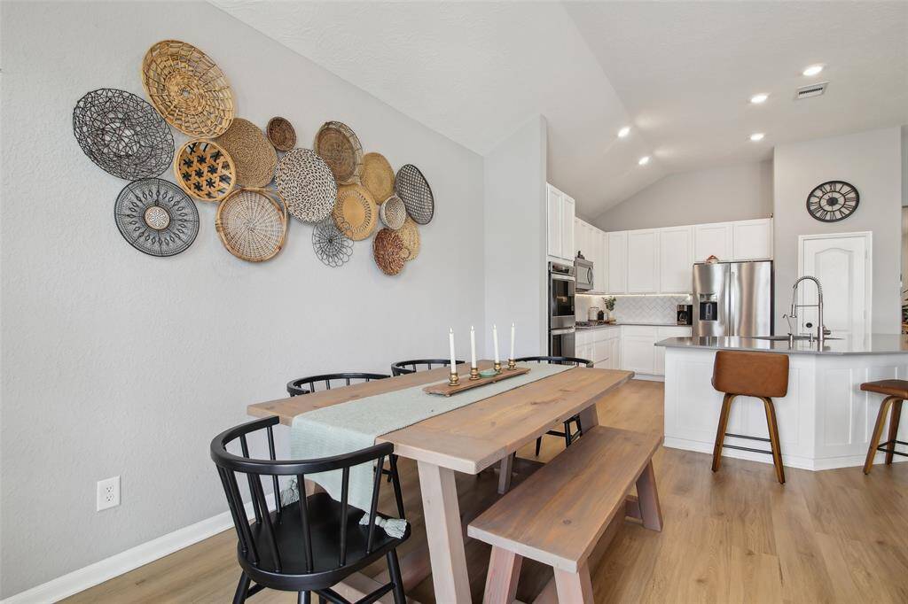 Well-lit with oversized windows, this space is ideal for everything from family dinners to festive gatherings.