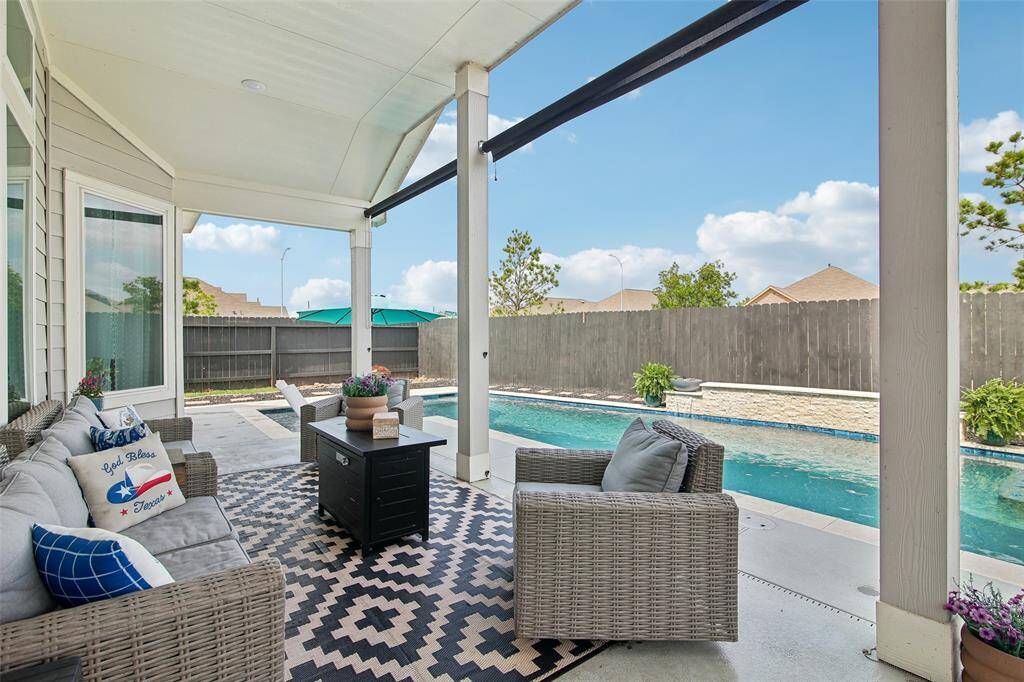 A spacious covered patio provides the perfect shaded area to relax.