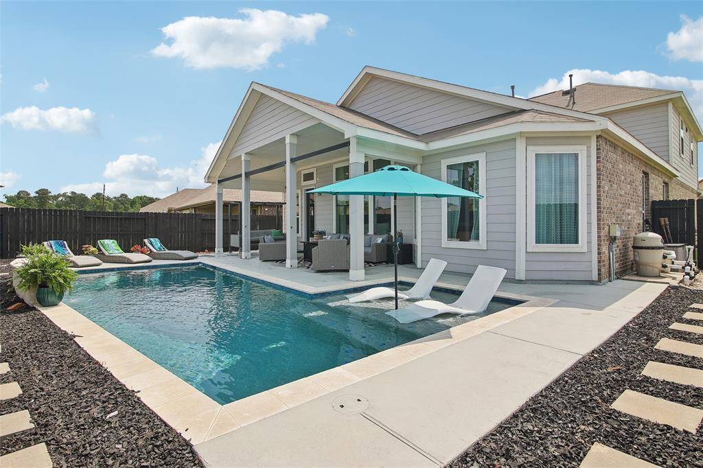 This outdoor space truly combines style, function, and tranquility for year-round enjoyment.
