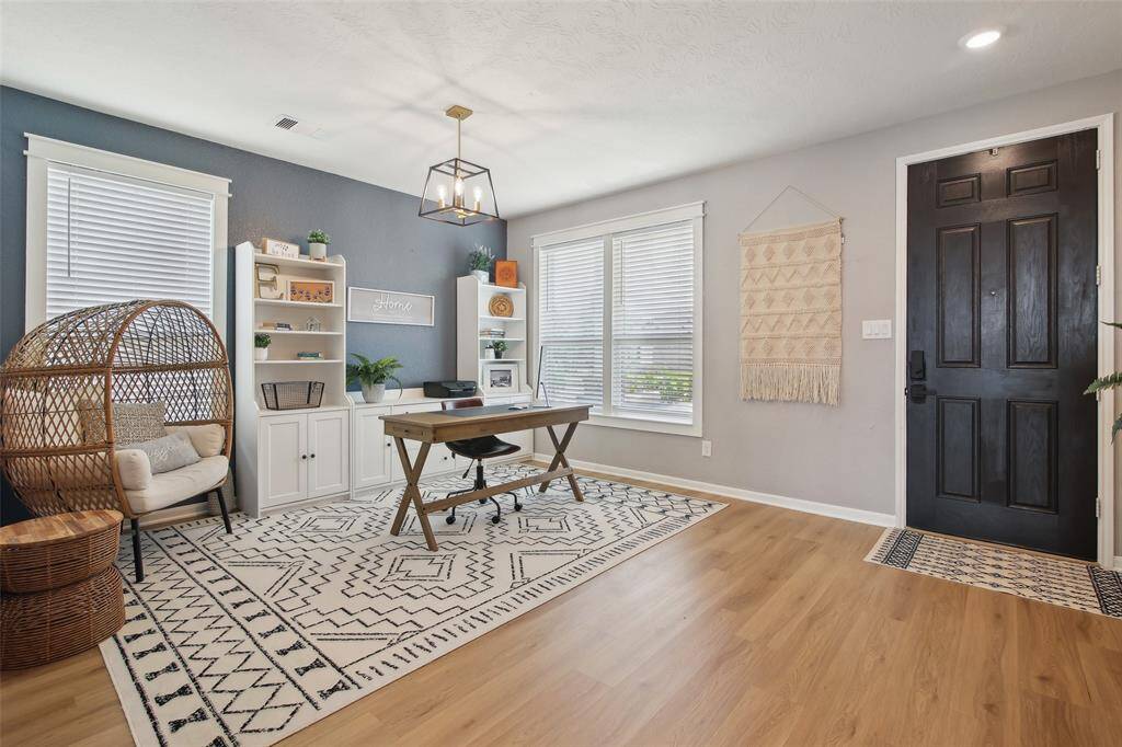 As you enter this beautifully designed home, you're greeted by an abundance of natural light and a warm, welcoming atmosphere.