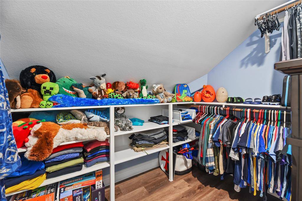 with a spacious closet and custom built-ins