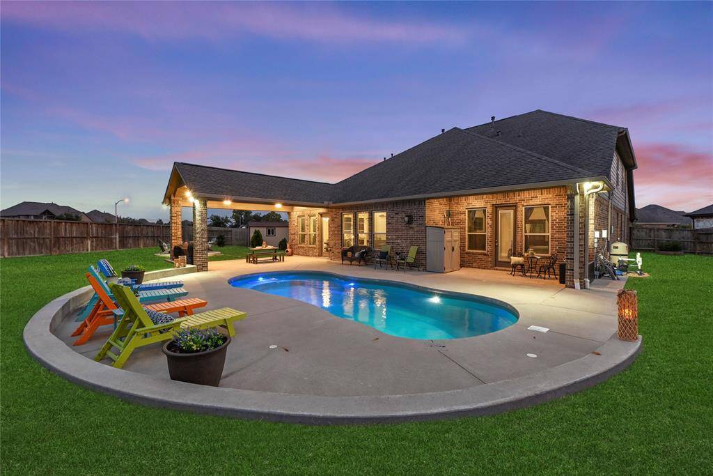 AMAZING oversized backyard! Are you ready to relax and splash in the sparkling pool!