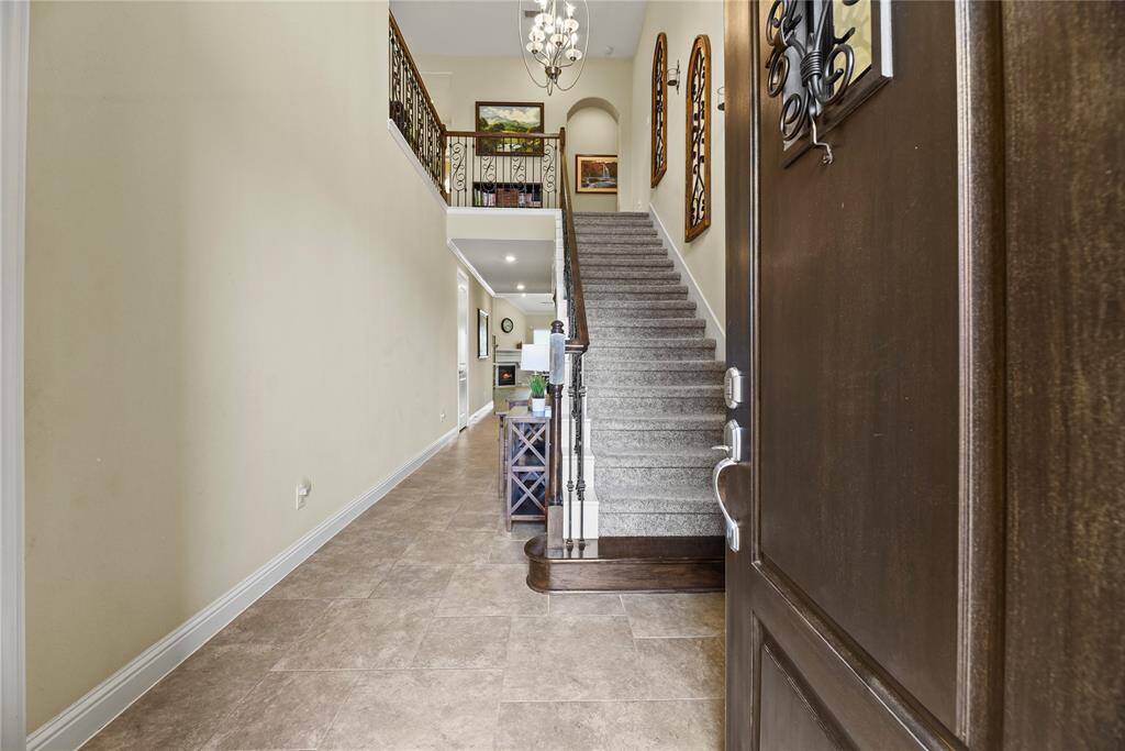 Soaring ceilings and extended tile floors sweep you in!