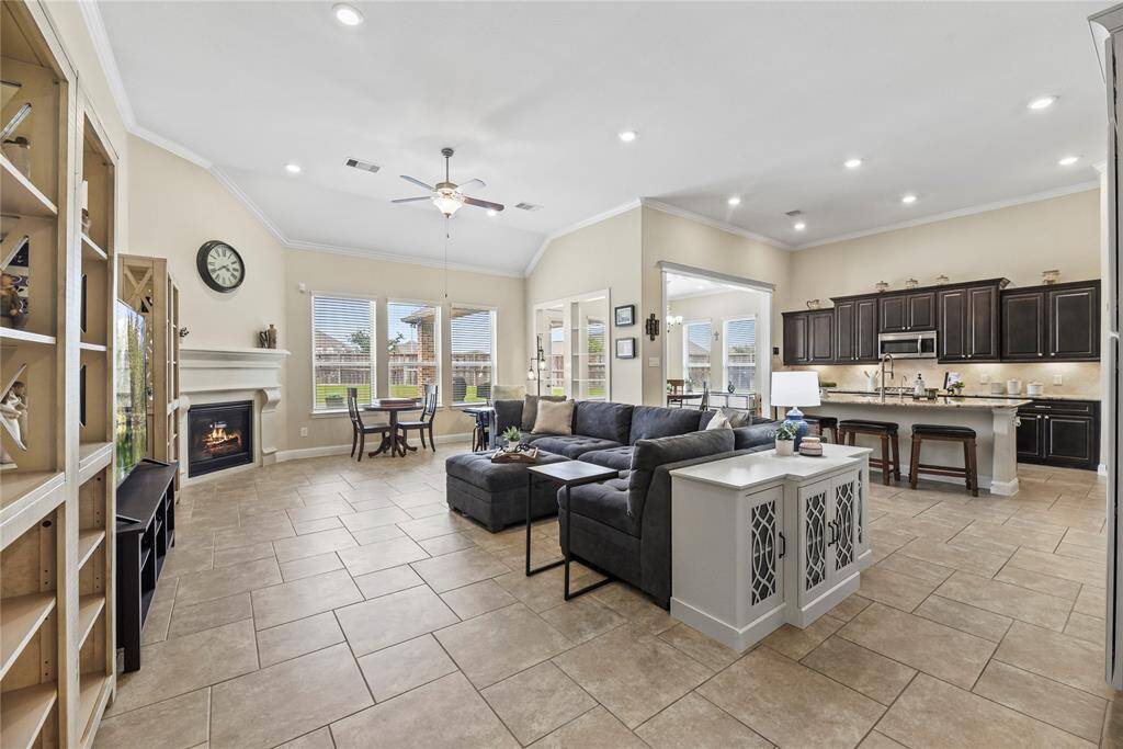 The open floor plan has great natural light and a cozy gas log fireplace!