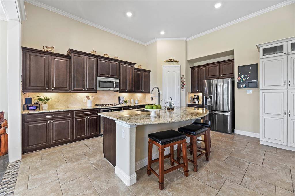 The island kitchen has lots of cabinet and counter space with a breakfast bar!