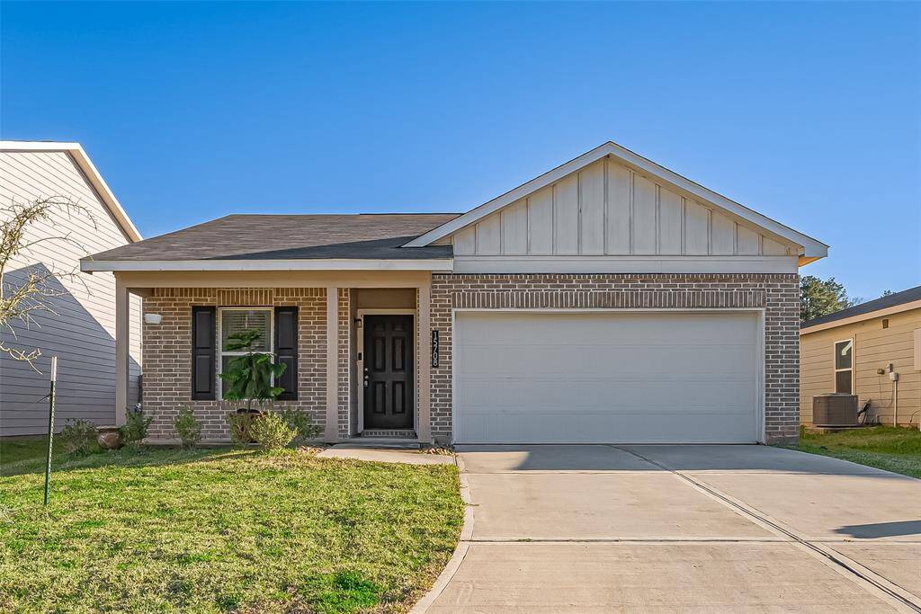 Charming single-story brick home with a two-car garage and a well-maintained front yard. The exterior features a cozy porch and modern design elements. Ideal for comfortable living.