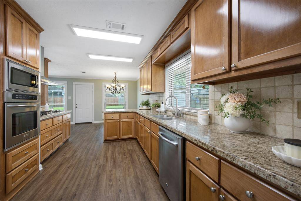 The kitchen, located to the right of the living room, combines functionality with style.It features sleek granite countertops, perfect for cooking and entertaining.