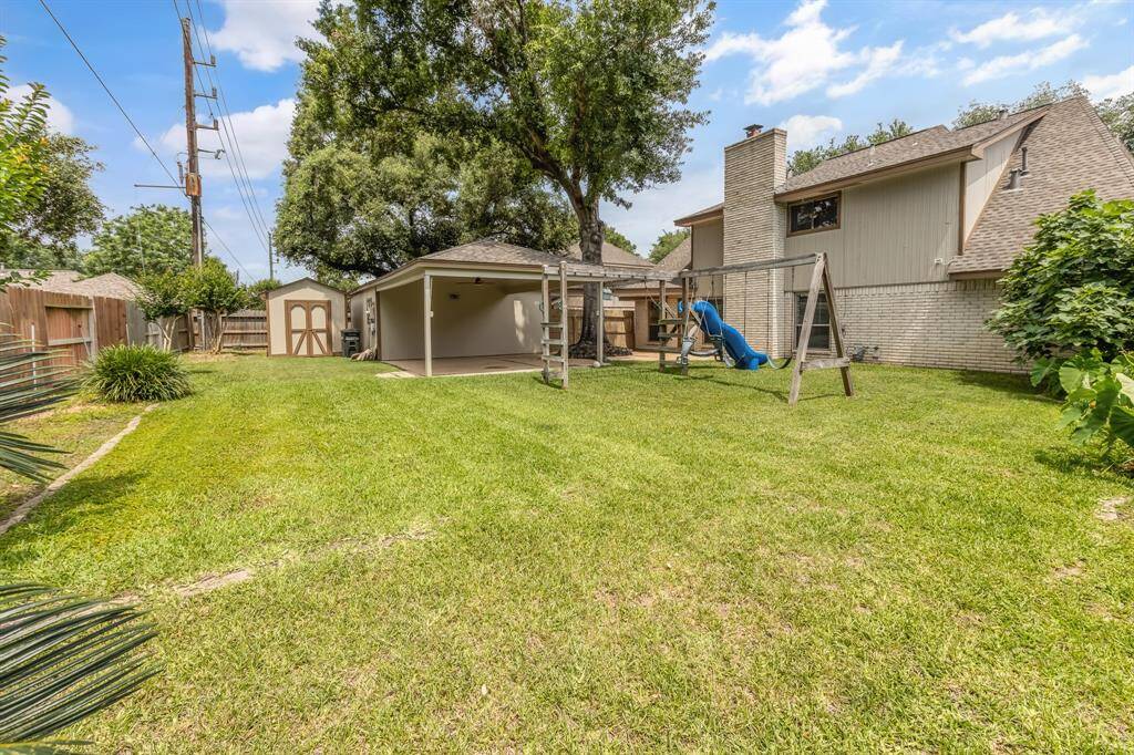 Backyard includes an outdoor storage building for added convenience, plus a portable generator connection for peace of mind during power outages. A practical and well-equipped space ready for all your needs!