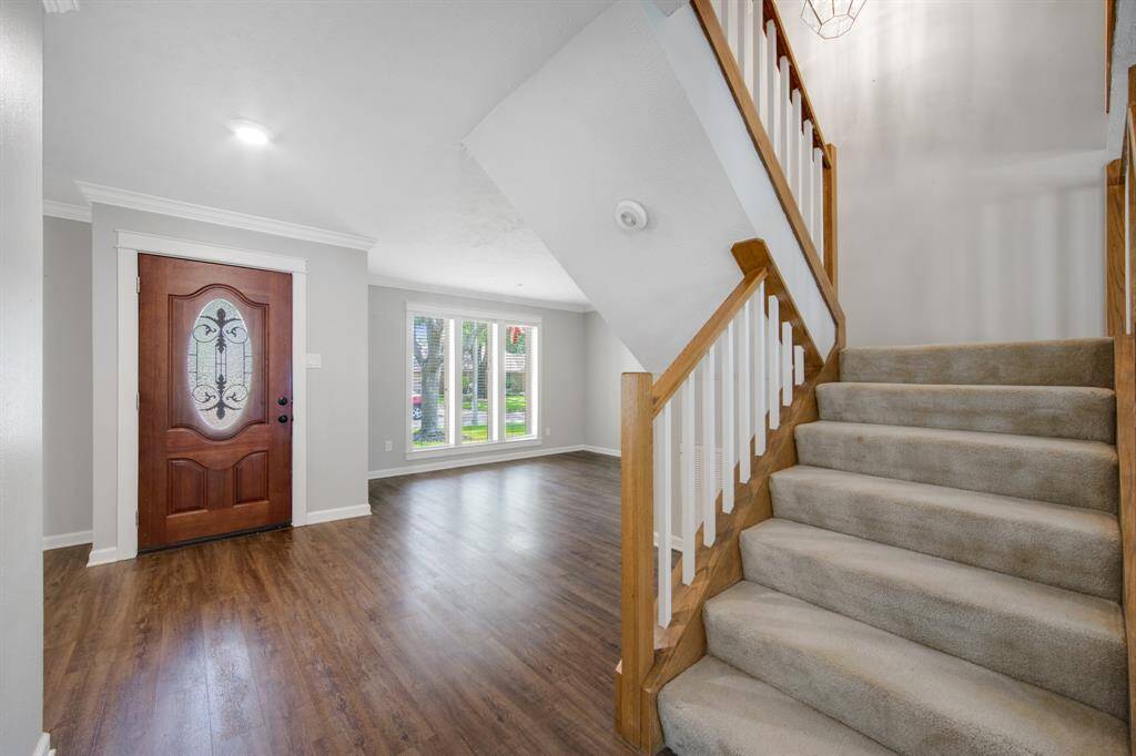 As you step inside, you're greeted by Luxury Vinyl Plank (LVP) flooring, installed in 2021 for a modern and durable touch.