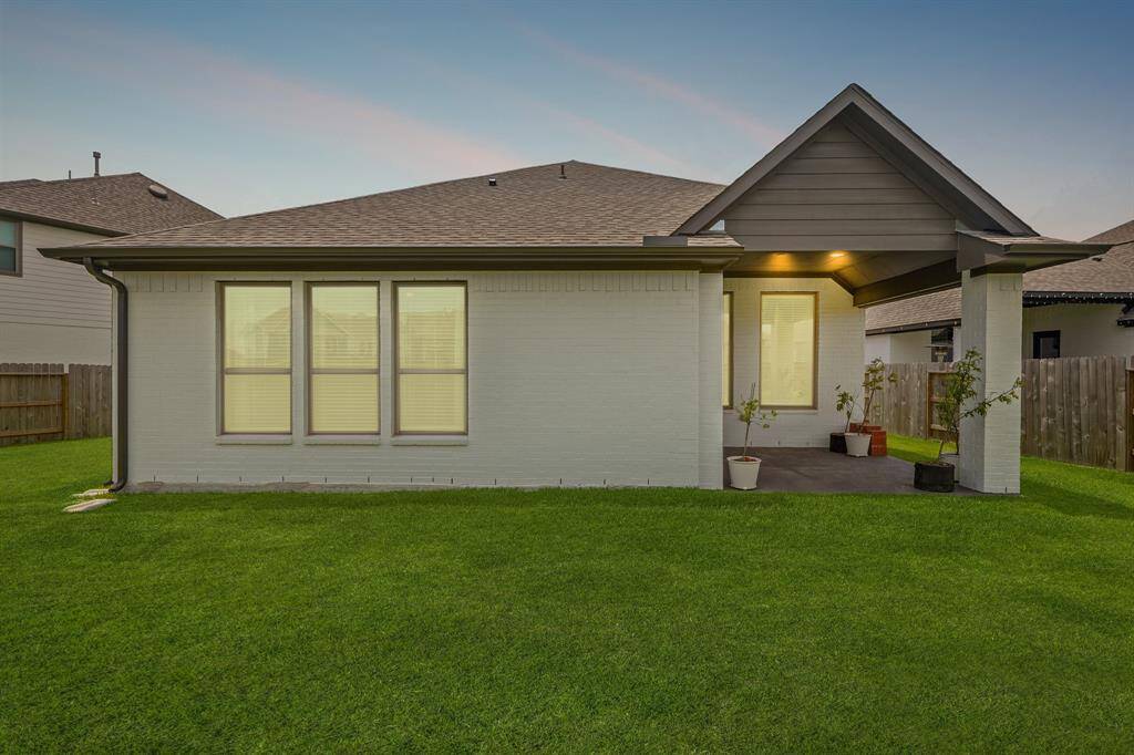 Welcome to your new backyard! The covered patio is perfect for gathering family and friends.