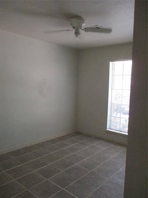 Ceiling fan in 3rd bedroom as well with 2022 tile