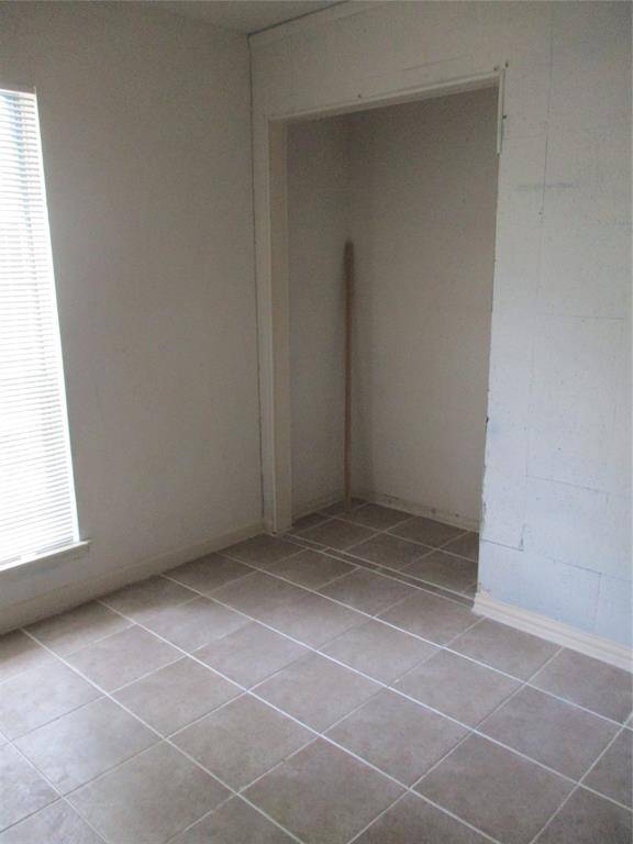 Corkboard wall in 1st bedroom by front door makes a great office.