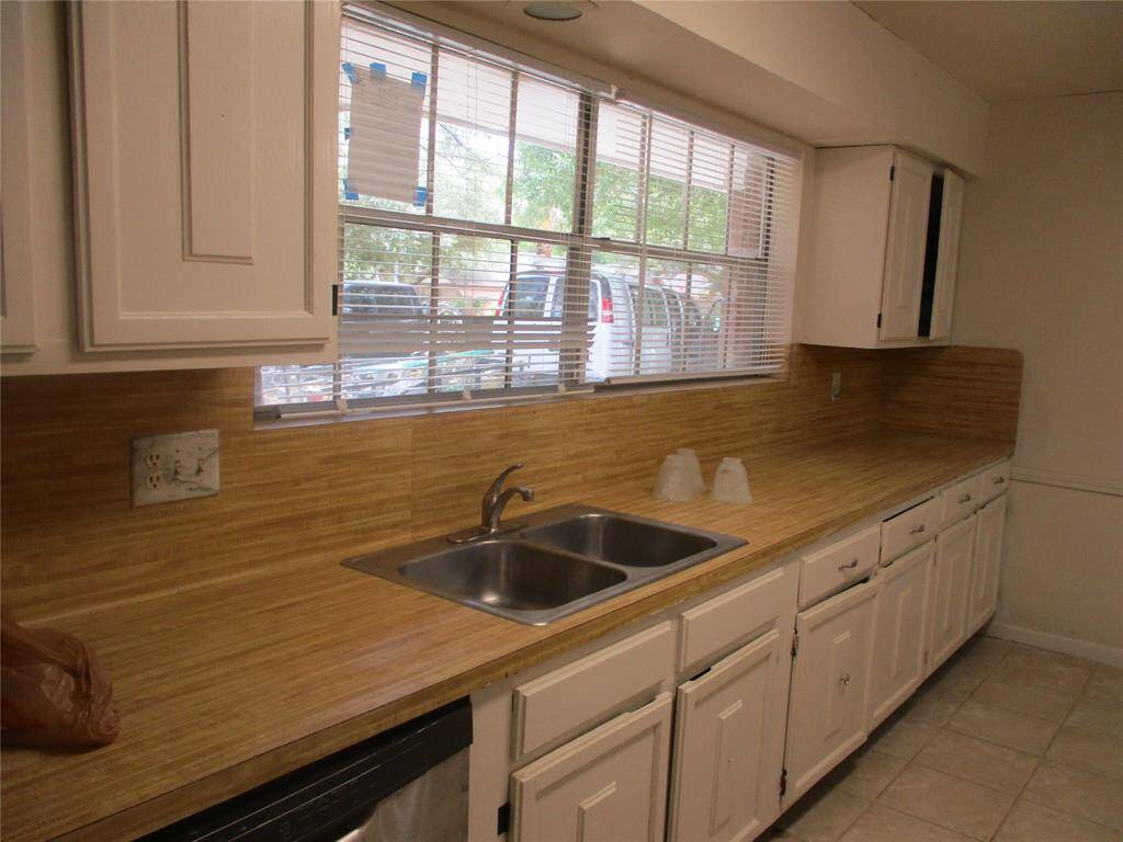 2022 kitchen faucet and recent dishwasher. lots of counter space and cabinets in the kitchen