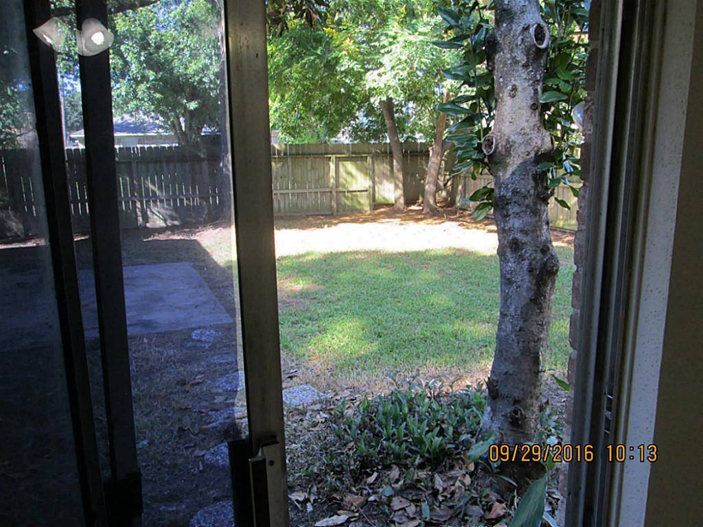 Patio door off master leads to back yard via stepping stones.