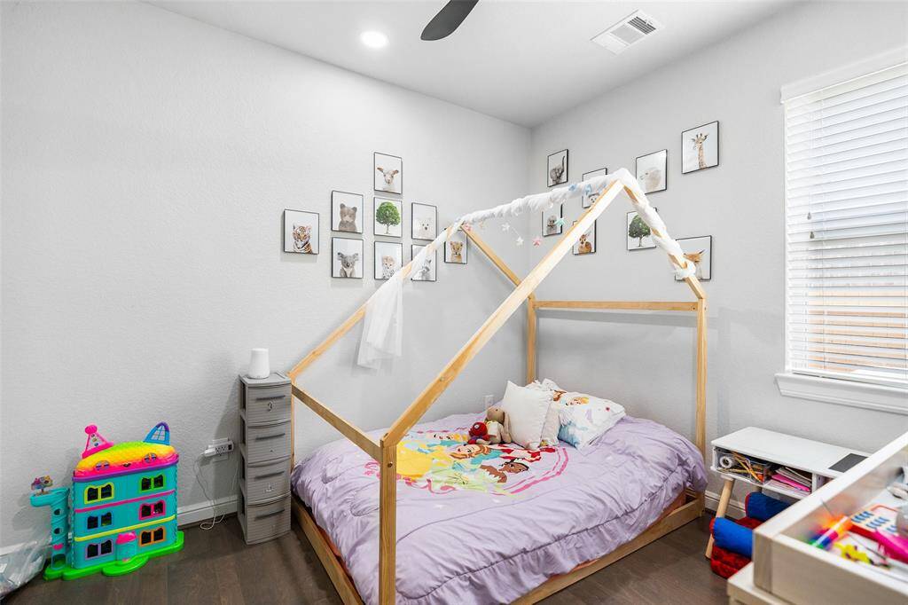 Convenient downstairs secondary bedroom offers flexibility for guests or multi-generational living.