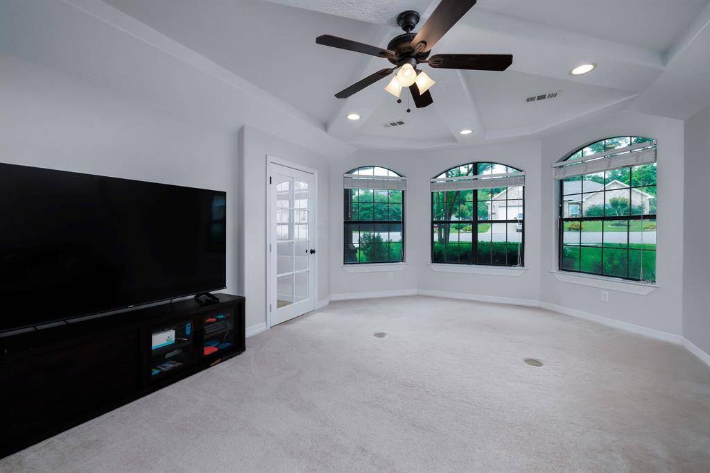 Another first floor living room area.  Lots of natural light, and beautiful custom ceilings.