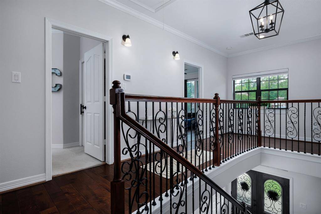 At the top of the custom wood staircase.