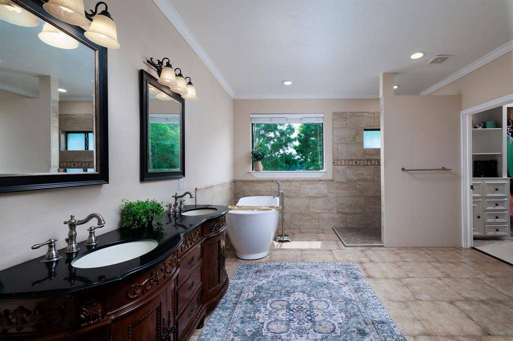 Updated and luxurious primary bath.  Double vanity, soaking tub, walk in shower - you own spa right at home.