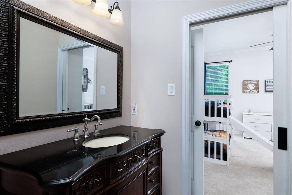 The second and third upstairs bedrooms both have access to this updated full bath in Jack and Jill style.