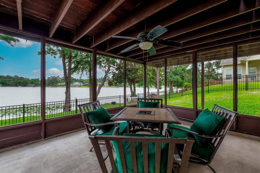 The downstairs deck area RIGHT ON THE WATER yet fully screened in.  Another full deck above it upstairs.