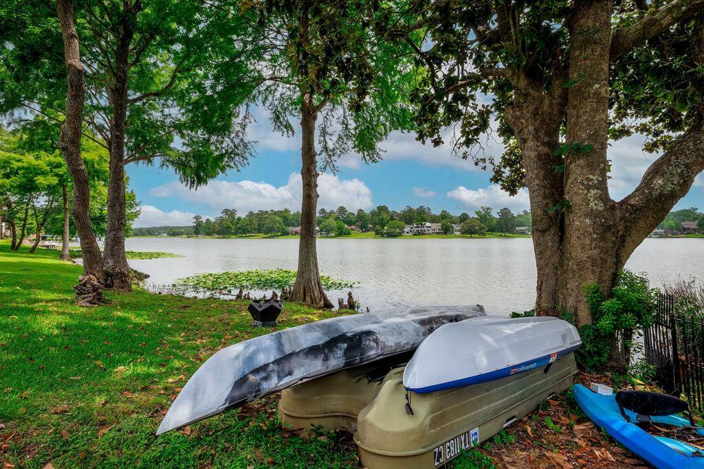 Your lakefront property in the shade of beautiful/mature trees.  Might be the perfect spot for a hammock!