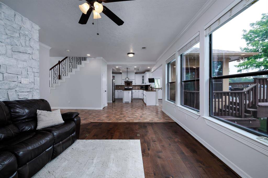 This living area open to the kitchen has abundant windows and wonderful lake views!