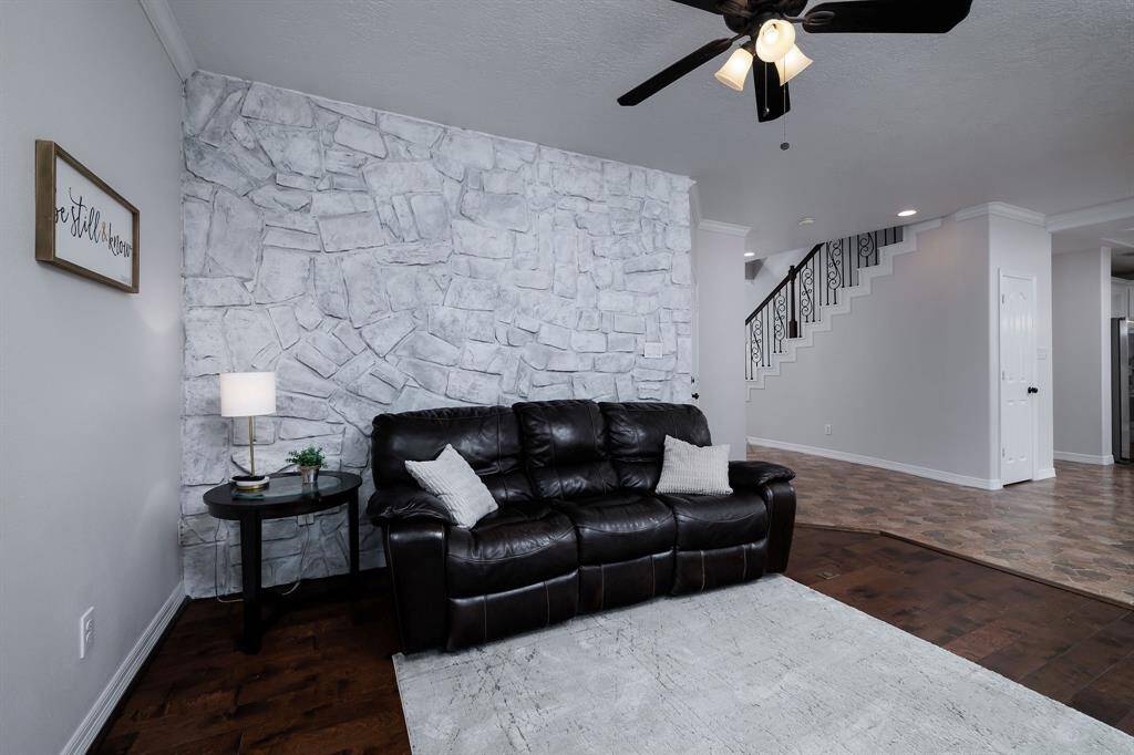Newly whitewashed stone wall in this room just off of and open to the kitchen.