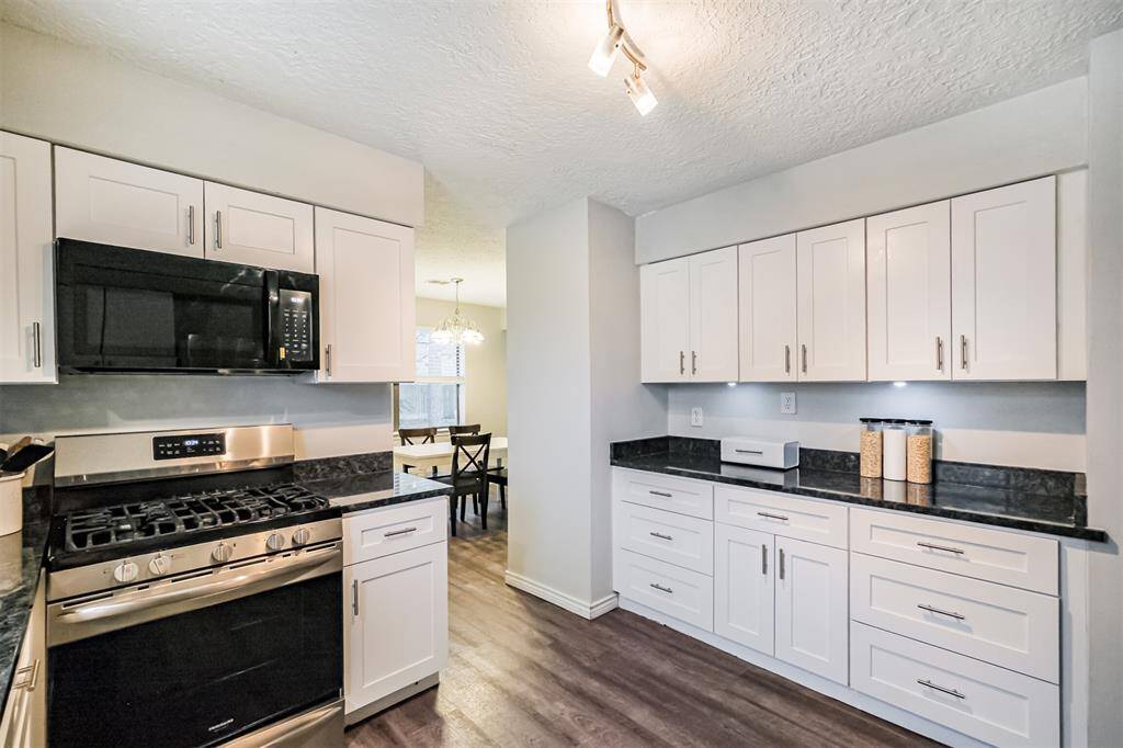 Turning back towards the dining area we can immediately see the plethora of cabinets.