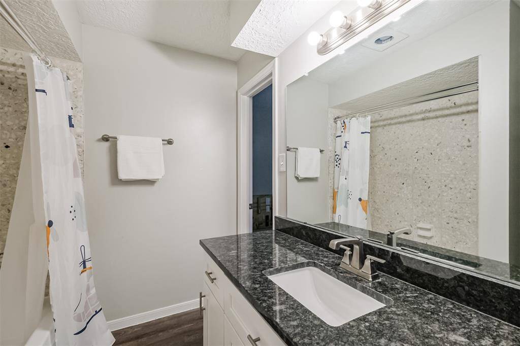 Around the corner is the secondary full-sized bathroom.