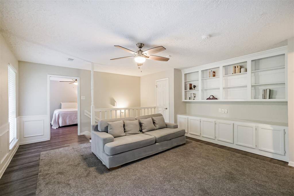 Beautiful built-ins anchor the wall and provide plenty of storage.