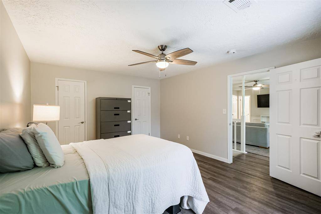 Standing in the bedroom looking back towards the door and game room.